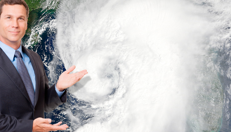 Weather man showing a large hurricane covering portions of the US.
