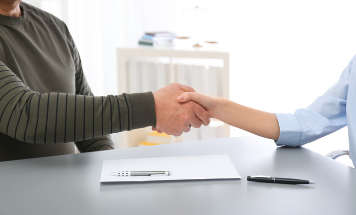 Public Adjuster shaking hand with client