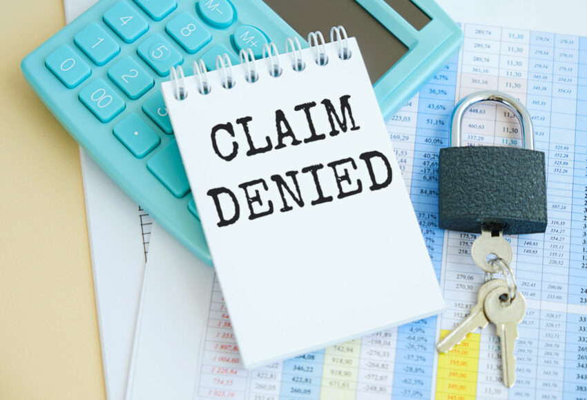 Glasses and calculator with text Claim Denied